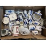A box of mixed blue and white ware