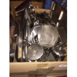 A box of stainless steel kitchen items.