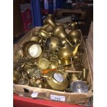 A box of small brass ornaments.