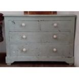 A painted pine chest of drawers, height 76cm, width 105.5cm and depth 46.5cm.