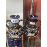 A pair of small Doulton stoneware vases.