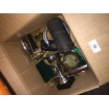 A box of trophies, metal horse shoe, brassware plaques, etc.