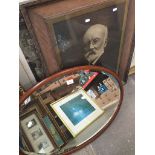 Oval mirror and a large portrait print