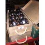 2 wooden boxes of metal boules