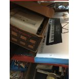 A Gear4Music MK-1000 keyboard and an Aldis slide projector