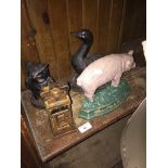 4 metal door stops - a duck, a pig, an owl and a 7 pound weight.