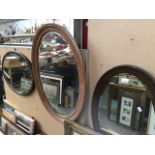 Three oval mirrors