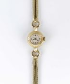 A LADIES 18K SOLID YELLOW GOLD ROLEX BRACELET WATCH CIRCA 1953, REF. 8646 WITH STAR INDICES AT 3-6-9