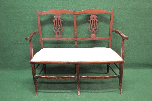Edwardian two seater chair back settee the back having pierced back splats supported by scrolled