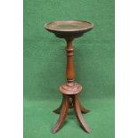 Mahogany plant stand having circular top supported on a turned column leading to four swept legs -