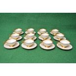 Set of twelve Czechoslovakian porcelain coffee cups and saucers having a cream ground with gilt