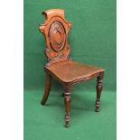 19th century oak hall chair having shaped pierced back over a shaped seat with bow front,