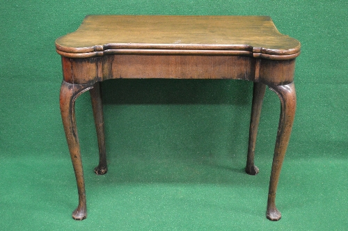 Georgian mahogany fold over card table the top opening to reveal green baized playing surface with