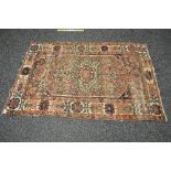 Rust ground rug having blue red and gold pattern - 53" x 80"