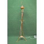 Arts & Crafts brass standard lamp the light fitting having scrolled brass support on a central