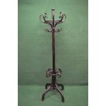 Painted bentwood coat stand having eight bentwood hanging hooks on a central column leading to
