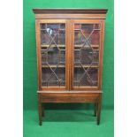 19th century mahogany glazed bookcase having moulded cornice over two glazed doors opening to