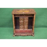 Painted Oriental side cabinet having gilt highlighted carved decoration and having two recessed