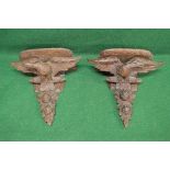 Pair of oak carved wall brackets each shelf having carved border supported by a carved eagle with