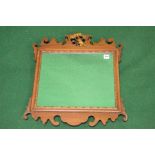 Mahogany bats wing wall mirror having a scrolled frame - 21.25" x 23.