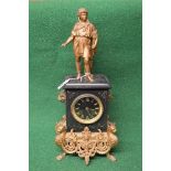 8 day slate and gilt painted metal mantle clock having figural top over black face with gilt Roman