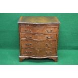 20th century mahogany serpentine fronted chest of drawers having cross banded top over brushing
