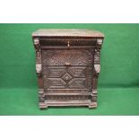 19th century oak carved side cabinet the top having moulded edge over single drawer with brass drop