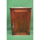 19th century oak wall hanging corner cupboard having moulded cornice and single panelled door