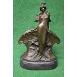 20th century bronze letter rack in the form of a standing lady on an oval black marble base,
