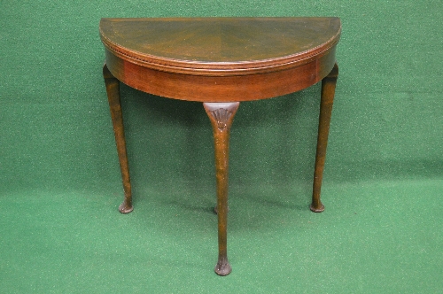 20th century mahogany demi lune fold over card table having cross banded top opening to reveal