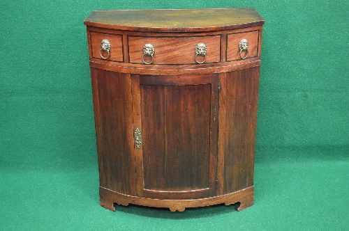 19th century mahogany bow fronted side cabinet the top lifting to reveal storage space over three