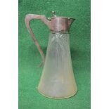 Silver mounted cut glass claret jug having an outward tapering glass body with silver mounts,
