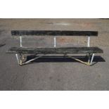20th century garden bench having scroll work metal frame with single wooden back board and three