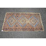 Blue ground rug having pattern of browns and dark blue - 33" x 60.