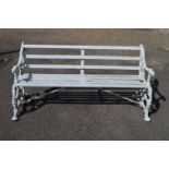 20th century metal framed garden bench having wooden slatted back and seat the ends in the form of