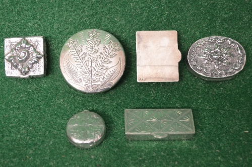 Group of six silver pill boxes having a mix of engraved and embossed raised decoration