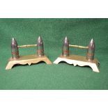 Pair of unusual brass fire iron rests being formed of Artillery bullets with mounted brass rests,