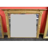 Gilt framed overmantle mirror the frame having decoration of columns with an inverted breakfront