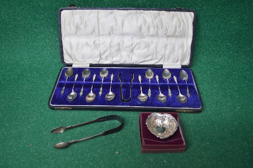 Cased set of twelve silver coffee spoons with matching sugar tongs,