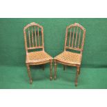 Pair of late 19th century gilt painted side chairs having carved ribbon decorated top rails