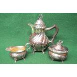 Swedish three piece silver teaset the teapot having floral finial and wooden handle,