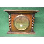 Oak wall hanging or free standing barometer having brass dial with black lettering and numbers,
