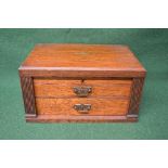 Oak cutlery canteen the top opening to reveal blue lined fitted interior over two drawers with