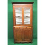 Victorian mahogany floor standing corner cupboard having two glazed doors opening to reveal three
