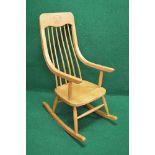 20th century Ercol style rocking chair having wide top rail carved with the initials HI supported