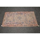 Pink ground rug having a blue pattern - 30" x 58"