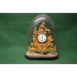 Gilt painted metal figural mantle clock having white dial with Roman Numerals and pierced black