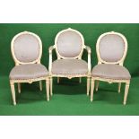Set of eight show wood framed painted dining chairs having hoop back with flower carved decoration