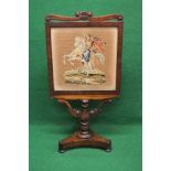 19th century rosewood fire screen the panel having needlework decoration of horse and rider in the