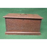 Small oak chest having single top brass carrying handle the lid opening to reveal storage space and